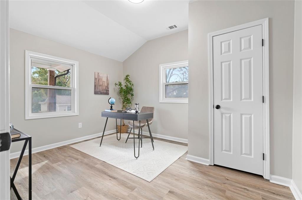 118 Perry Street Monroe, GA 30655 - Photo 16 of 30 a living room with furniture a window and a potted plant