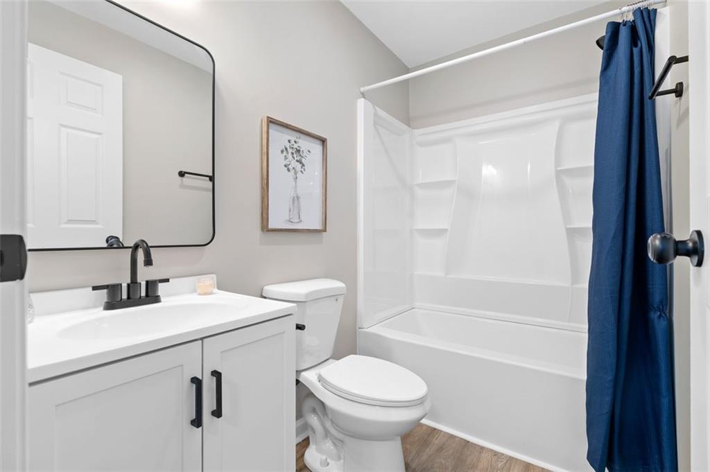 118 Perry Street Monroe, GA 30655 - Photo 19 of 30 a bathroom with a sink toilet and shower