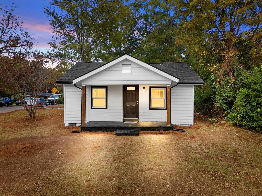 118 Perry Street Monroe, GA 30655 - Photo 2 of 30 a front view of a house with a yard