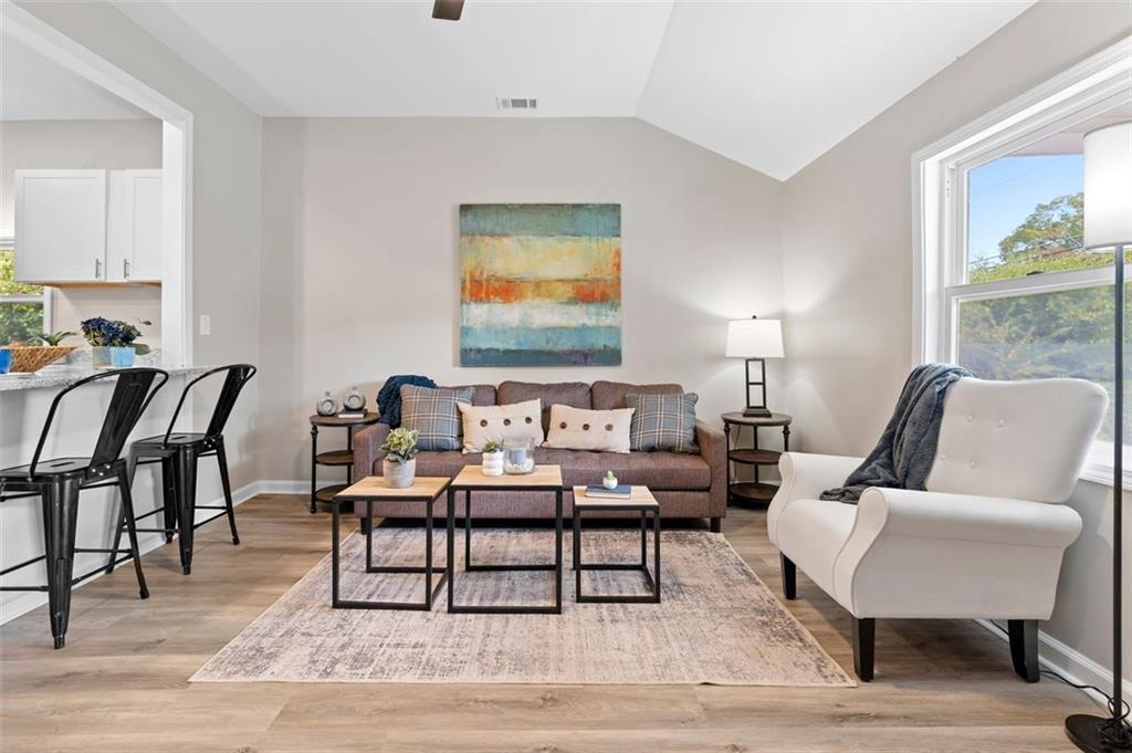 118 Perry Street Monroe, GA 30655 - Photo 5 of 30 a living room with furniture and wooden floor