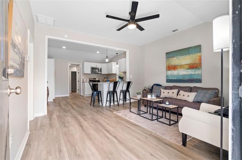 118 Perry Street Monroe, GA 30655 - Photo 6 of 30 a living room with furniture and a view of kitchen