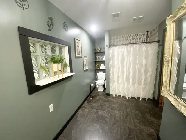 a view of a refrigerator in a kitchen