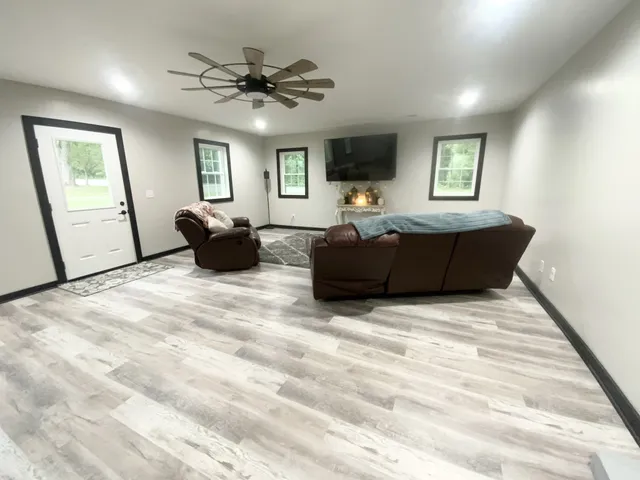 a living room with furniture and a flat screen tv