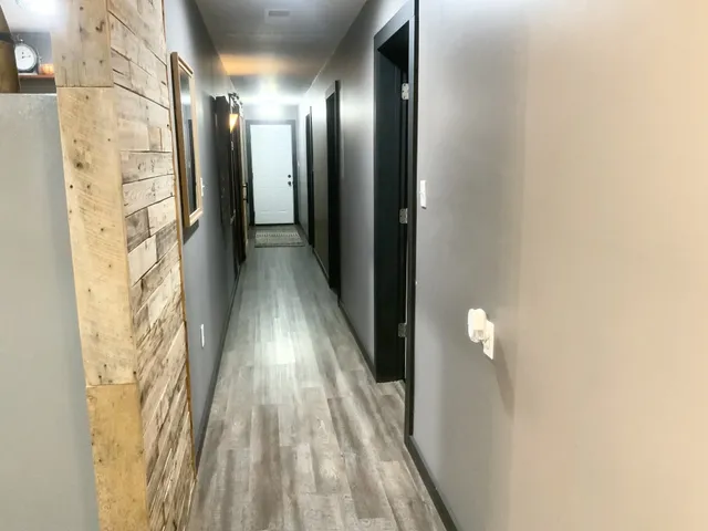 a view of gallery with wooden floor