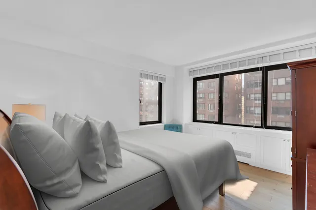 a bedroom with a bed and window