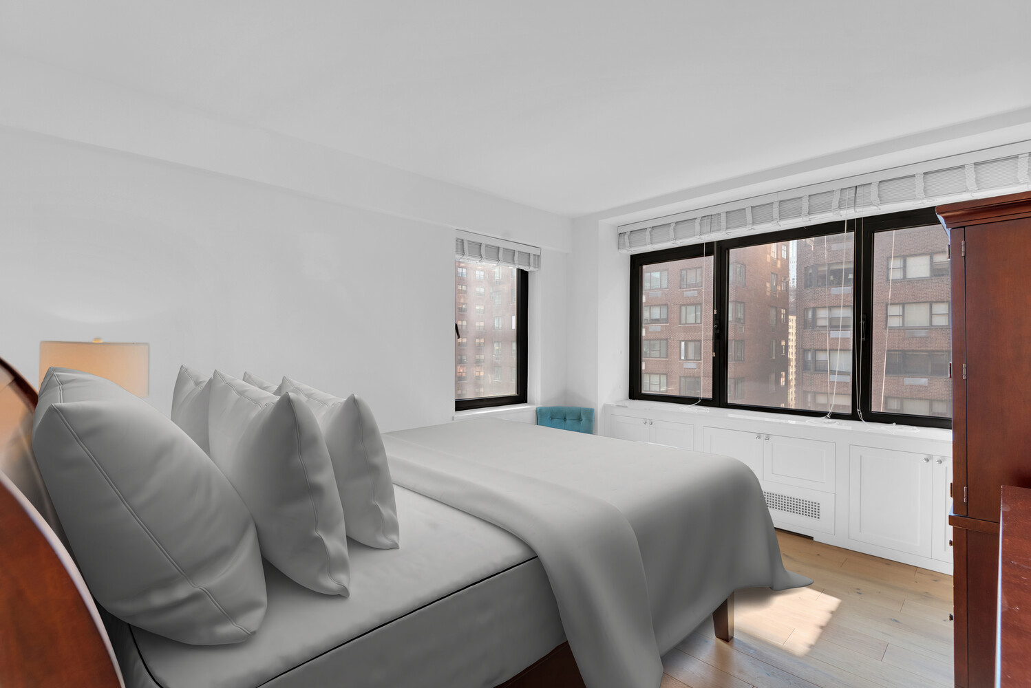 25 Sutton Place South, Unit 14A Manhattan, NY 10022 - Photo 7 of 17 a bedroom with a bed and window