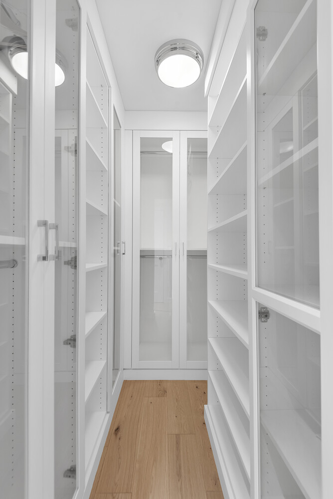 25 Sutton Place South, Unit 14A Manhattan, NY 10022 - Photo 8 of 17 a view of walk in closet with empty racks