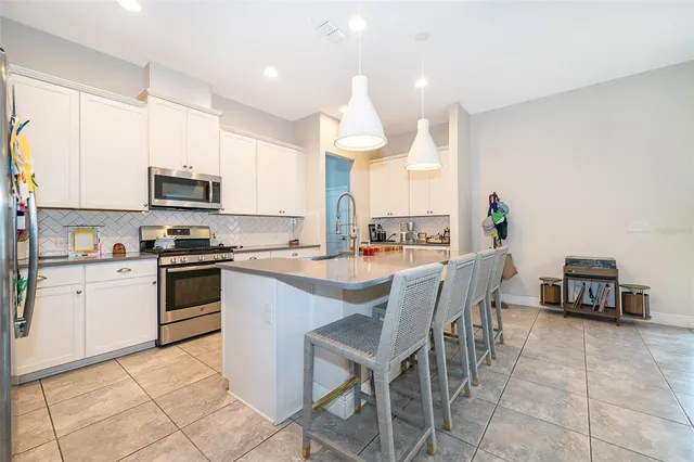 a kitchen with a sink cabinets and window