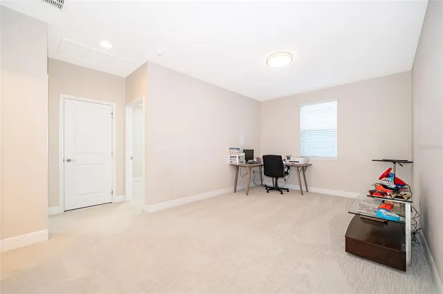 a living room with furniture and a piano
