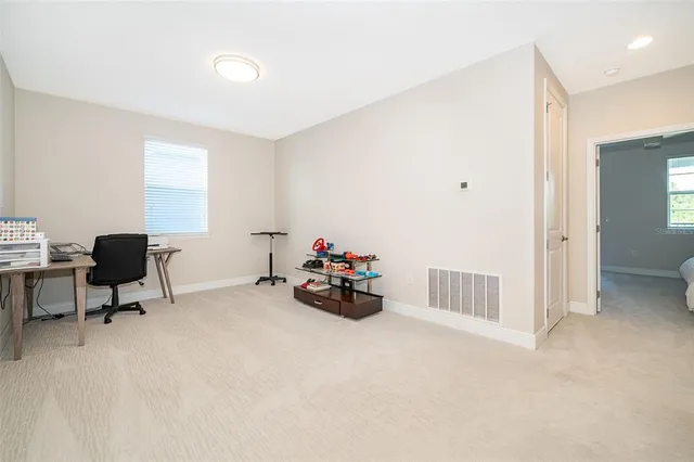 a view of a room with furniture and toys