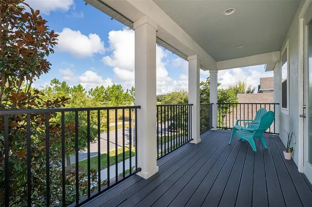 a view of a balcony with wooden floor