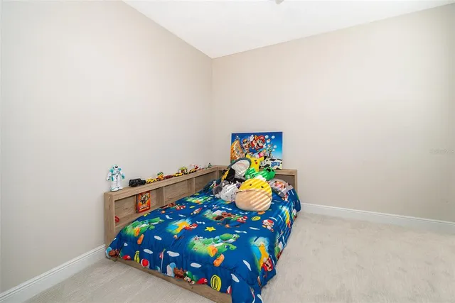 a bedroom with a bed and a dresser