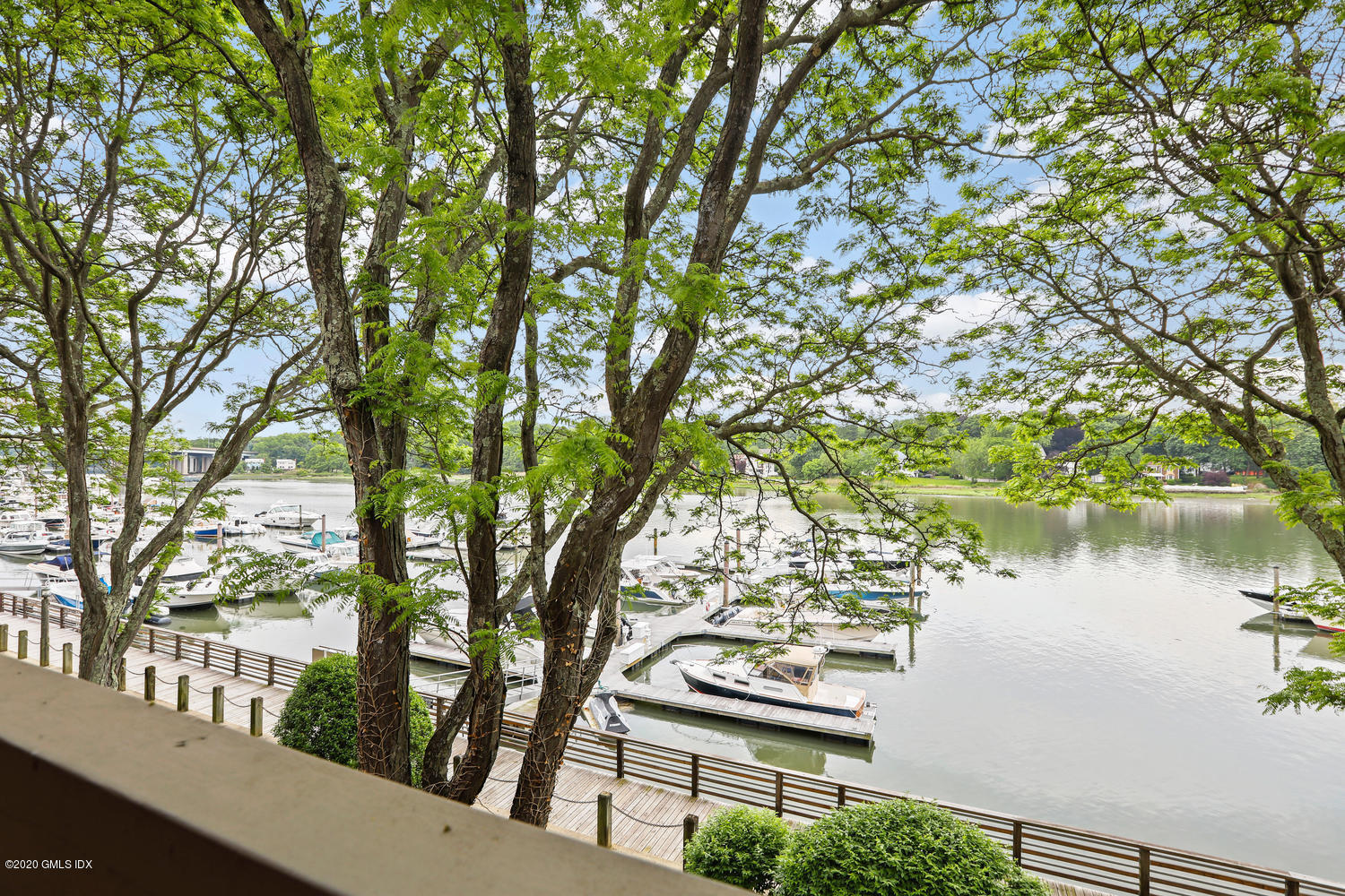 a view of lake from balcony with outdoor seating