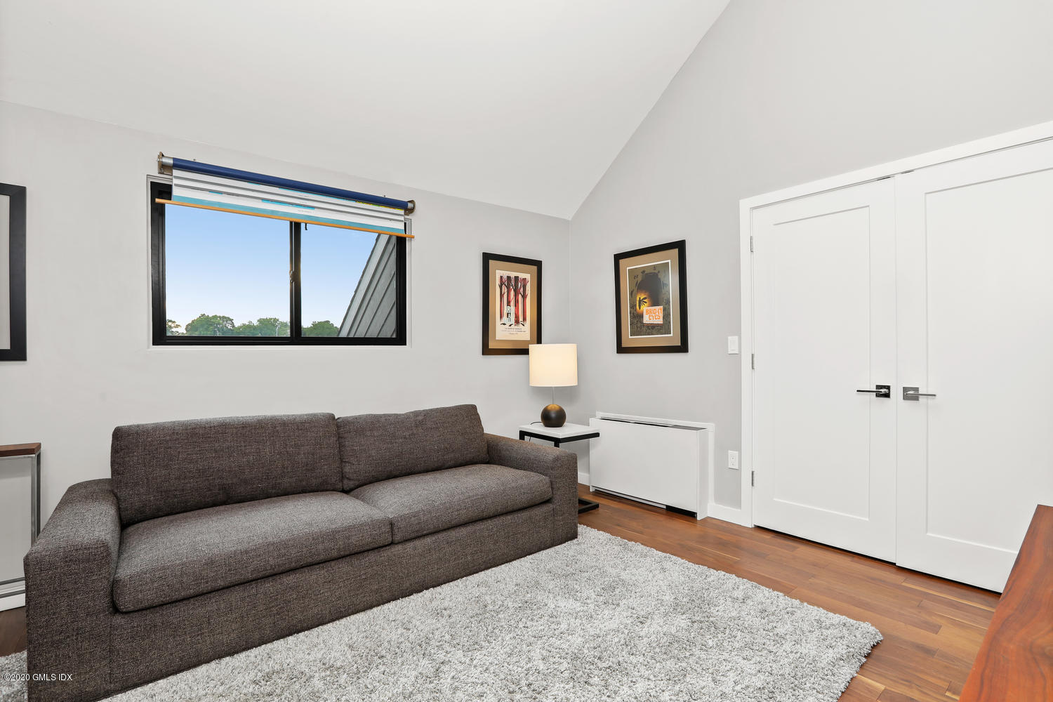 11 River Road, Unit 112 Cos Cob, CT 06807 - Photo 11 of 27 a living room with furniture and a wooden floor