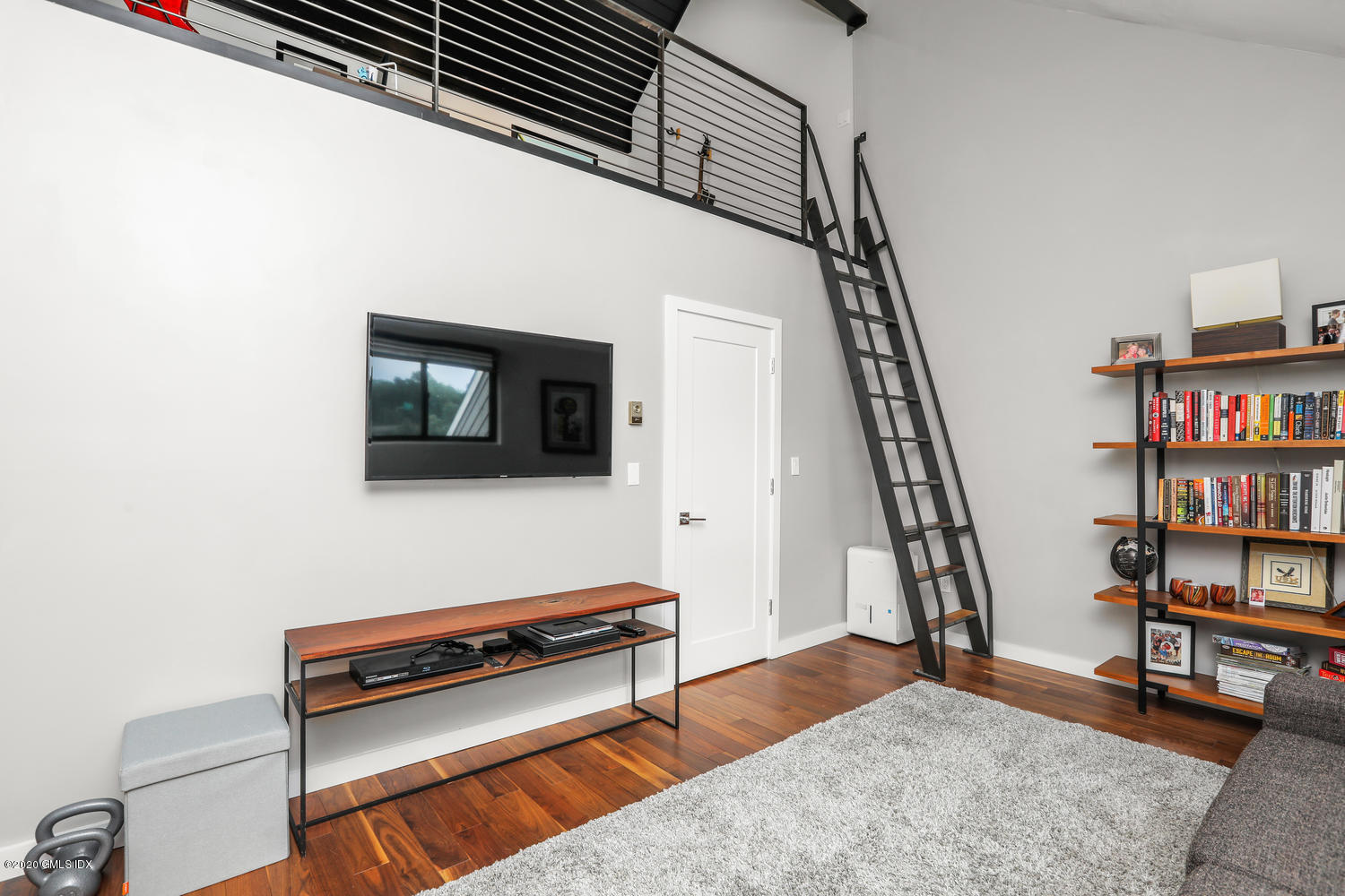 11 River Road, Unit 112 Cos Cob, CT 06807 - Photo 12 of 27 a living room with furniture and a flat screen tv