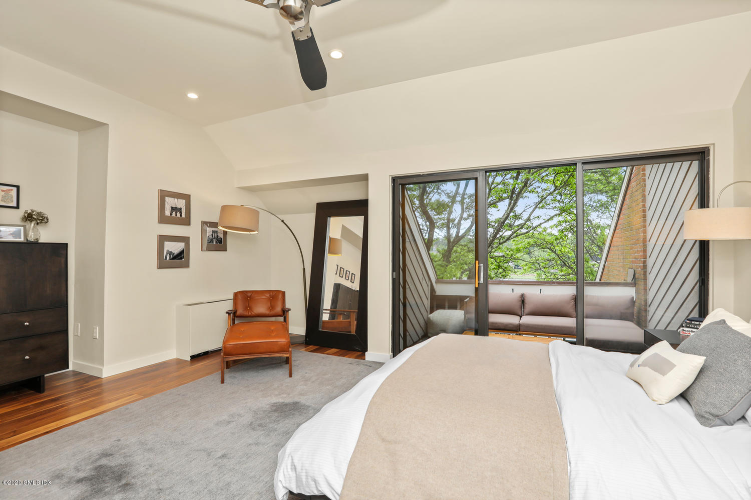 11 River Road, Unit 112 Cos Cob, CT 06807 - Photo 13 of 27 a bedroom with a bed and large window