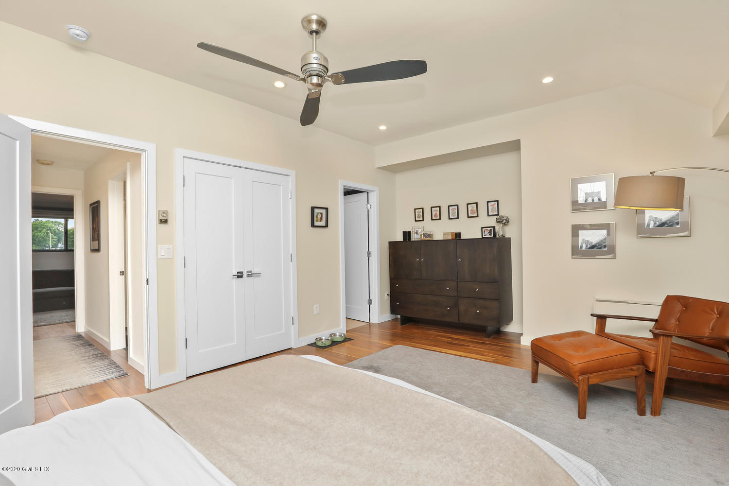11 River Road, Unit 112 Cos Cob, CT 06807 - Photo 14 of 27 a bedroom with furniture and a ceiling fan