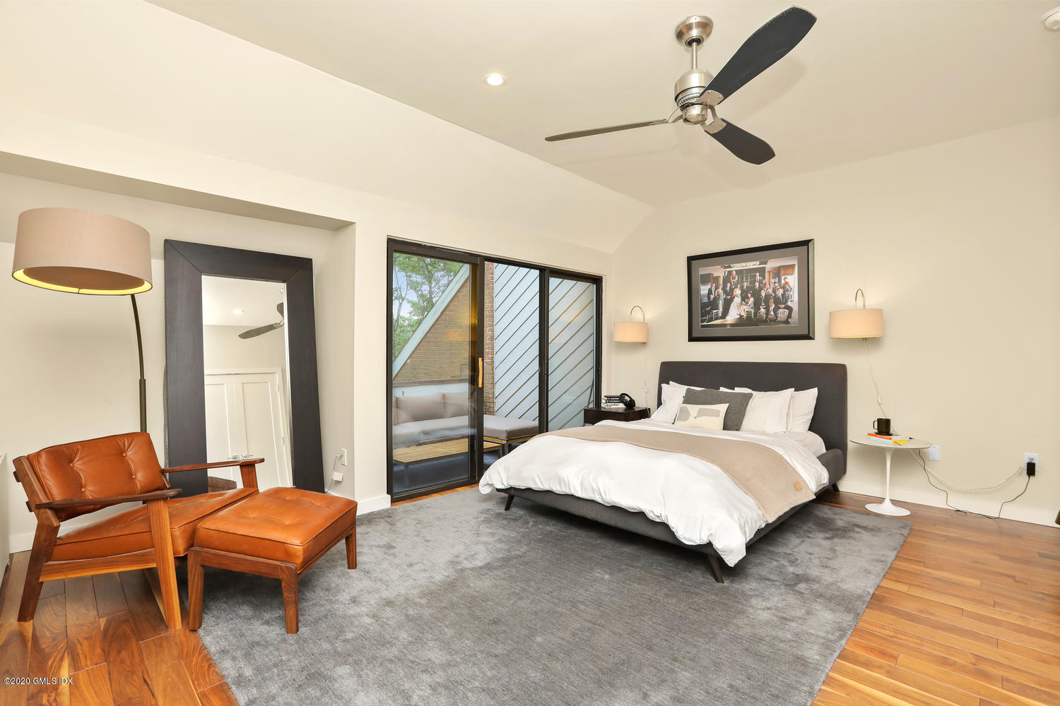 11 River Road, Unit 112 Cos Cob, CT 06807 - Photo 16 of 27 a bedroom with a bed couch and a window