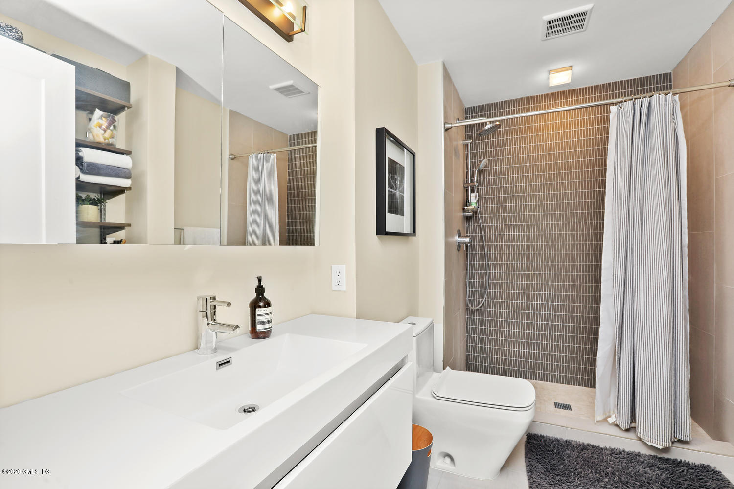 11 River Road, Unit 112 Cos Cob, CT 06807 - Photo 17 of 27 a bathroom with a sink toilet and shower