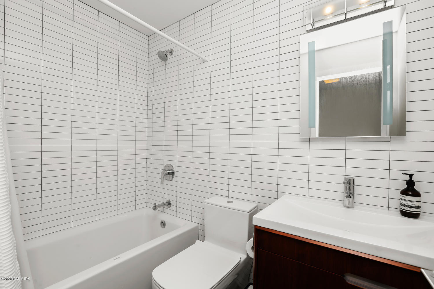 11 River Road, Unit 112 Cos Cob, CT 06807 - Photo 18 of 27 a bathroom with a sink a toilet and shower