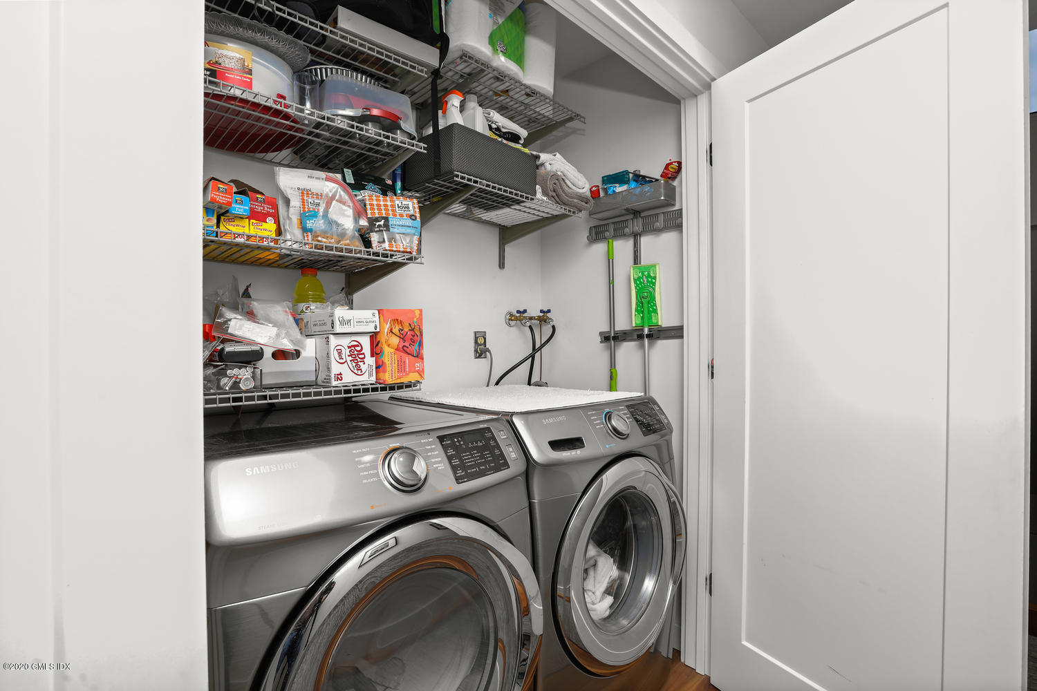 11 River Road, Unit 112 Cos Cob, CT 06807 - Photo 23 of 27 a utility room with dryer and washer