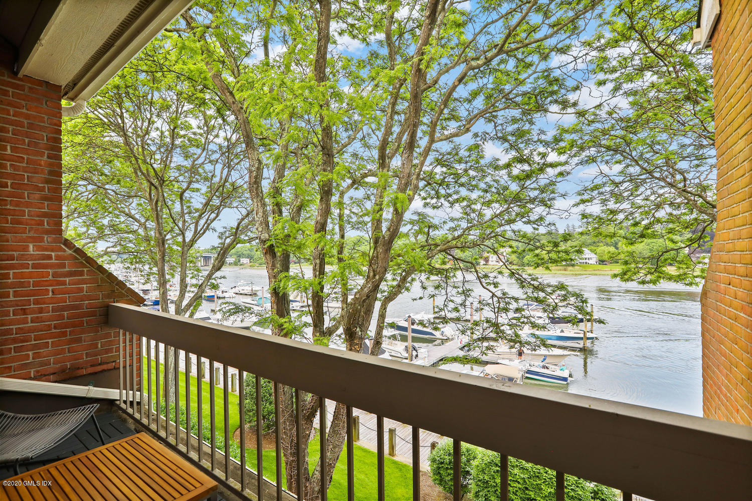 11 River Road, Unit 112 Cos Cob, CT 06807 - Photo 24 of 27 a view of balcony and trees