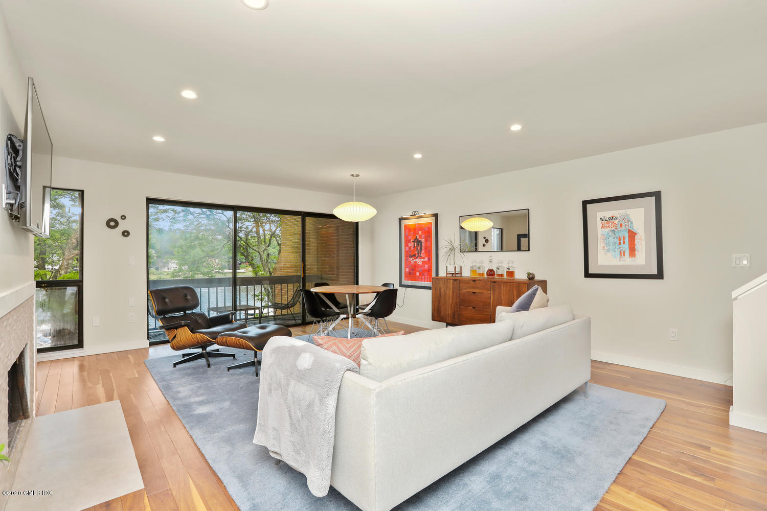 11 River Road, Unit 112 Cos Cob, CT 06807 - Photo 6 of 27 a living room with furniture large window and a wooden floor
