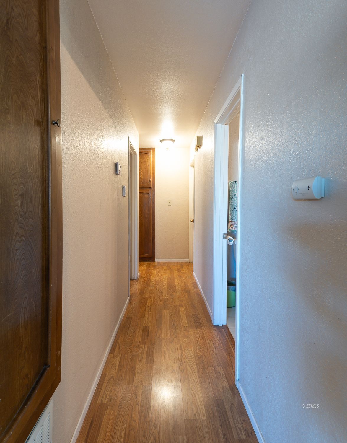617 South Downs Street Ridgecrest, CA 93555 - Photo 11 of 34 a view of a hallway with wooden floor