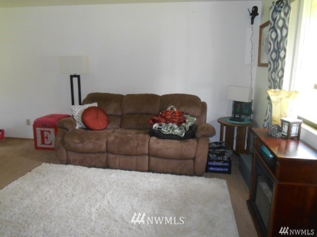 506 208th Street Southeast, Unit 1 & 2 Bothell, WA 98012 - Photo 2 of 10 a living room with furniture a rug and a window