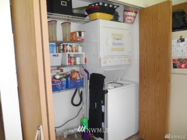 506 208th Street Southeast, Unit 1 & 2 Bothell, WA 98012 - Photo 5 of 10 a shelf with books and knick knacks on it