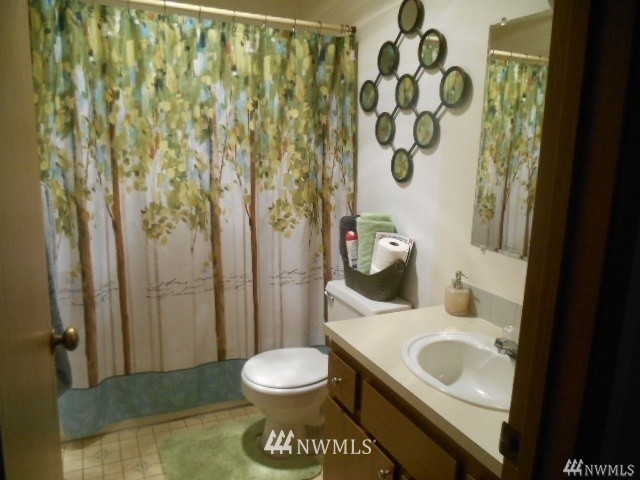 506 208th Street Southeast, Unit 1 & 2 Bothell, WA 98012 - Photo 6 of 10 a bathroom with a sink toilet and shower