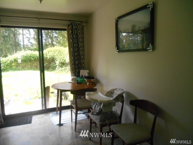 506 208th Street Southeast, Unit 1 & 2 Bothell, WA 98012 - Photo 7 of 10 a view of a dining room with furniture and a window