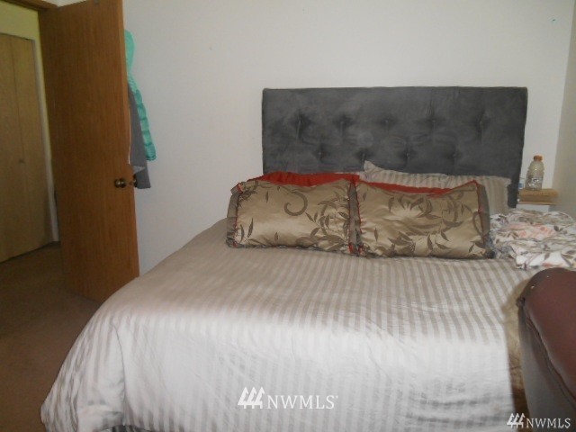506 208th Street Southeast, Unit 1 & 2 Bothell, WA 98012 - Photo 8 of 10 a bedroom with a bed and wooden floor