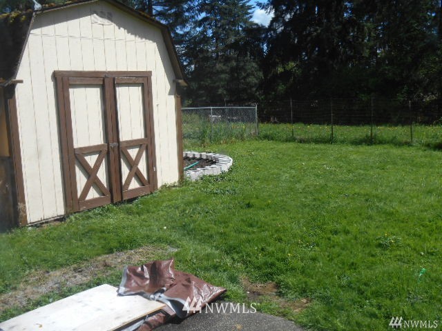 506 208th Street Southeast, Unit 1 & 2 Bothell, WA 98012 - Photo 10 of 10 a view of backyard with a barn and large trees