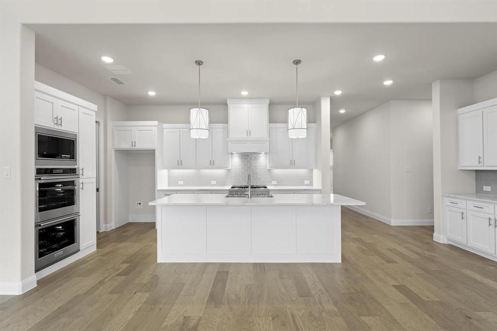 3208 Andesite Road McKinney, TX 75071 - Photo 9 of 38 The Burkhart B Kitchen
