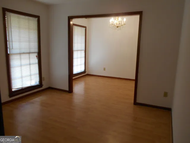 a view of an empty room with a window