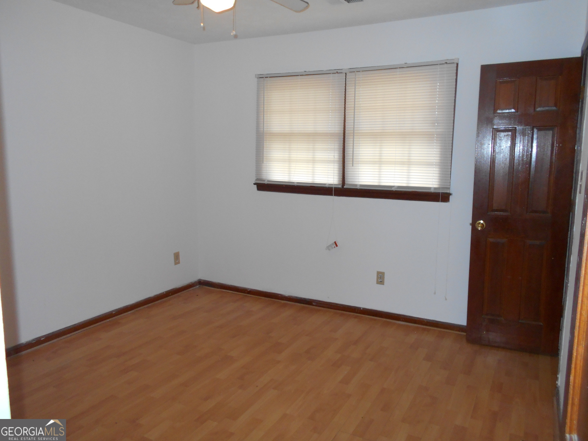 551 Racetrack Road McDonough, GA 30252 - Photo 9 of 11 an empty room with a window