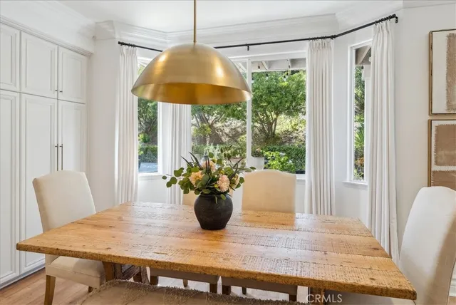 a kitchen with kitchen island granite countertop wooden floor and center island