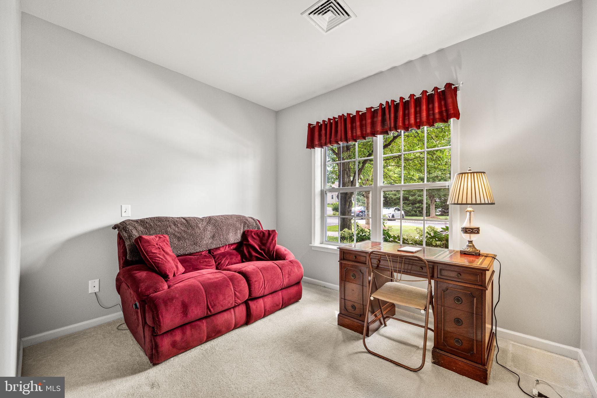 113 Creekside Drive, Unit 3 Brookhaven, PA 19015 - Photo 19 of 26 a living room with furniture and a large window