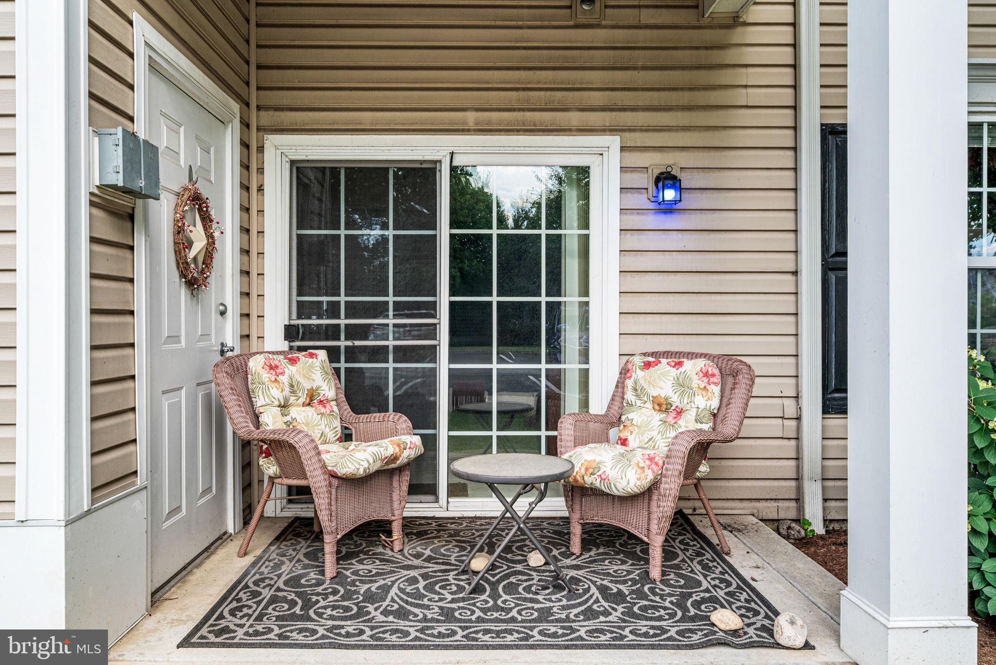 113 Creekside Drive, Unit 3 Brookhaven, PA 19015 - Photo 23 of 26 a view of a two chairs in the porch