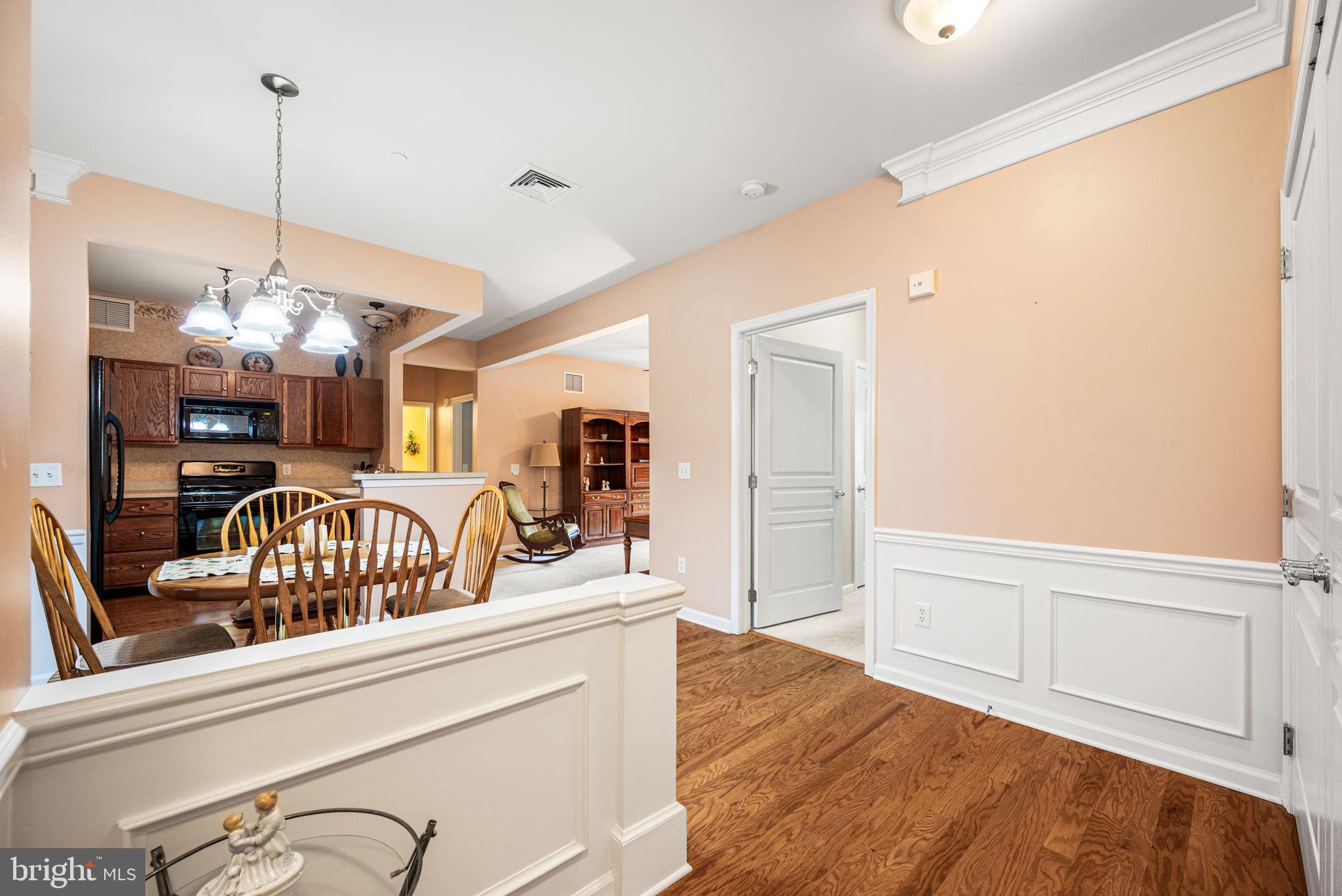 113 Creekside Drive, Unit 3 Brookhaven, PA 19015 - Photo 5 of 26 a view of living room and kitchen with wooden floor