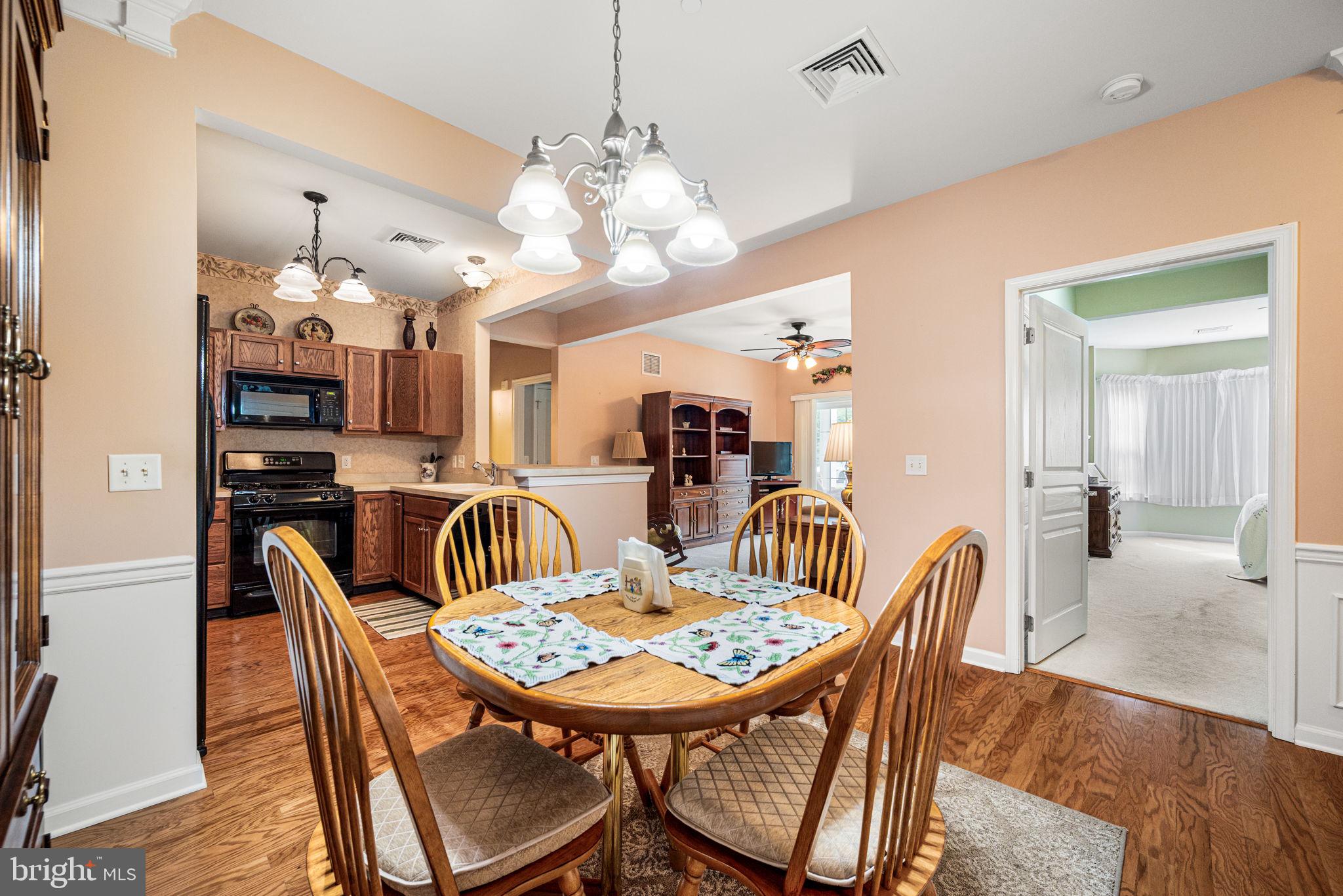 113 Creekside Drive, Unit 3 Brookhaven, PA 19015 - Photo 6 of 26 a view of a dining room with furniture and wooden floor