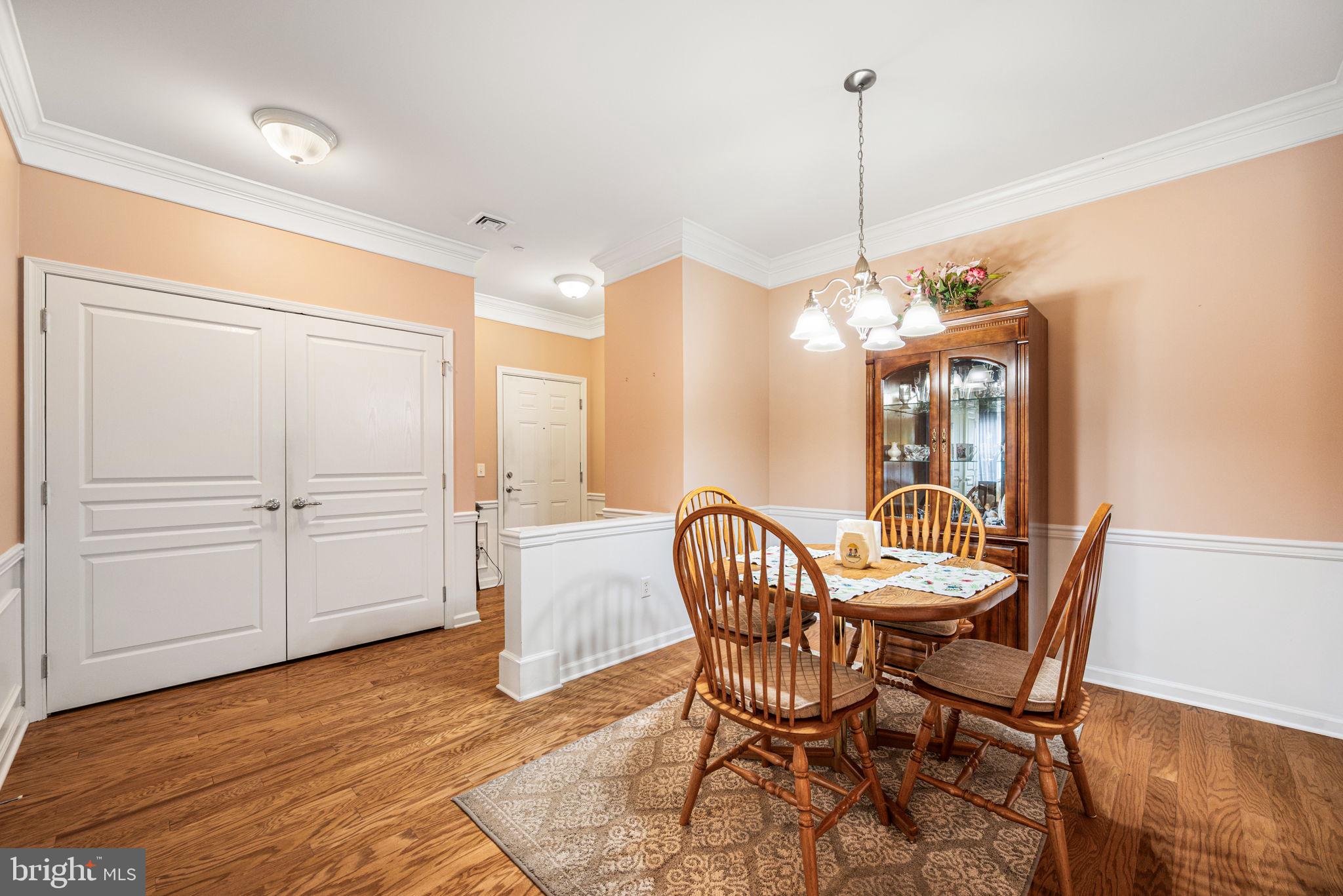 113 Creekside Drive, Unit 3 Brookhaven, PA 19015 - Photo 7 of 26 a view of a dining room with furniture and wooden floor