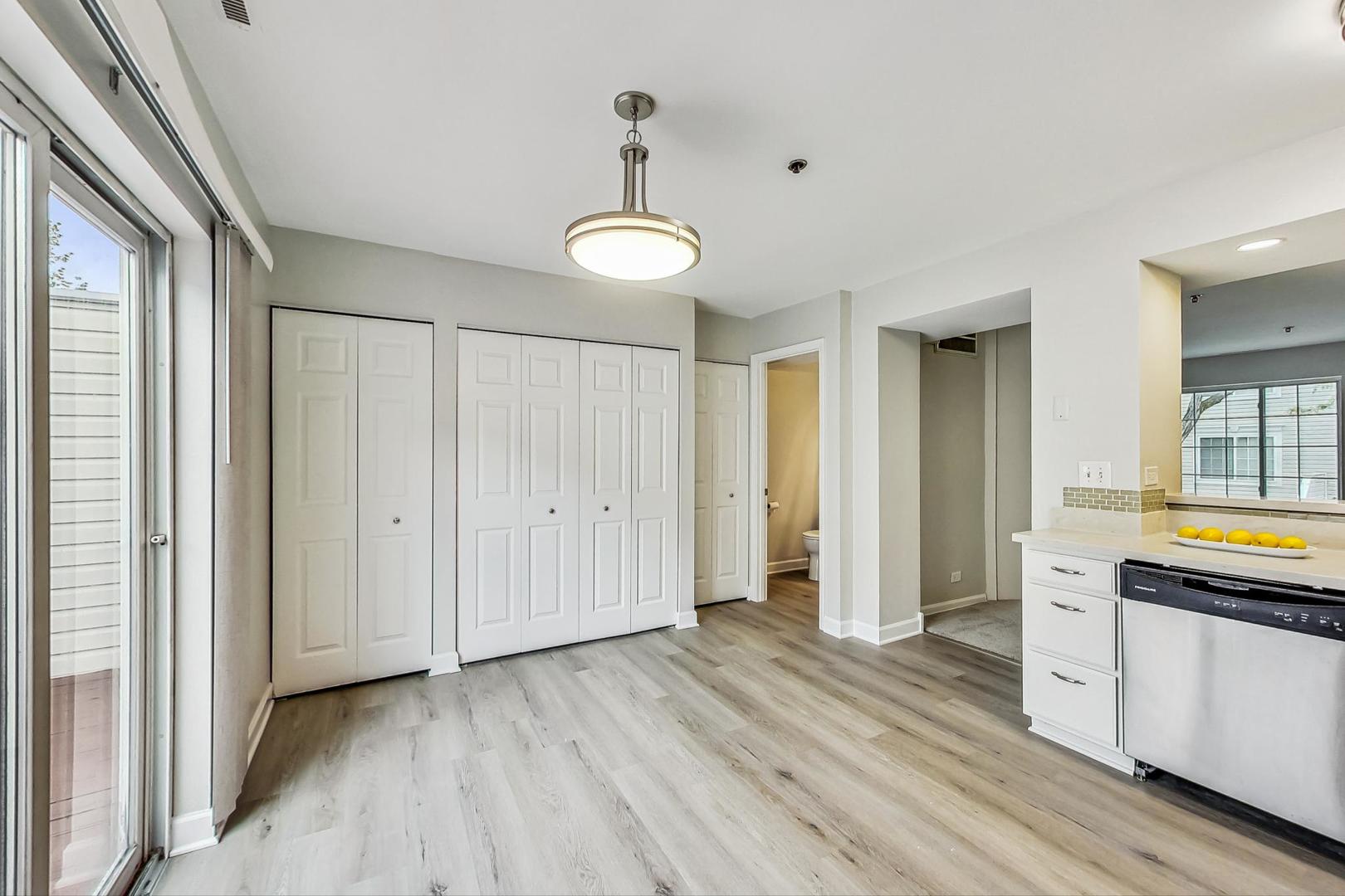 313 Rosebud Court, Unit 313 Bolingbrook, IL 60440 - Photo 12 of 31 a view of room with wooden floor and window