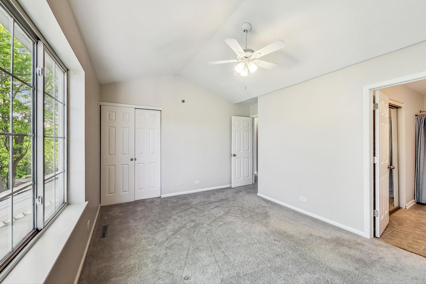 313 Rosebud Court, Unit 313 Bolingbrook, IL 60440 - Photo 22 of 31 a view of an empty room with a window