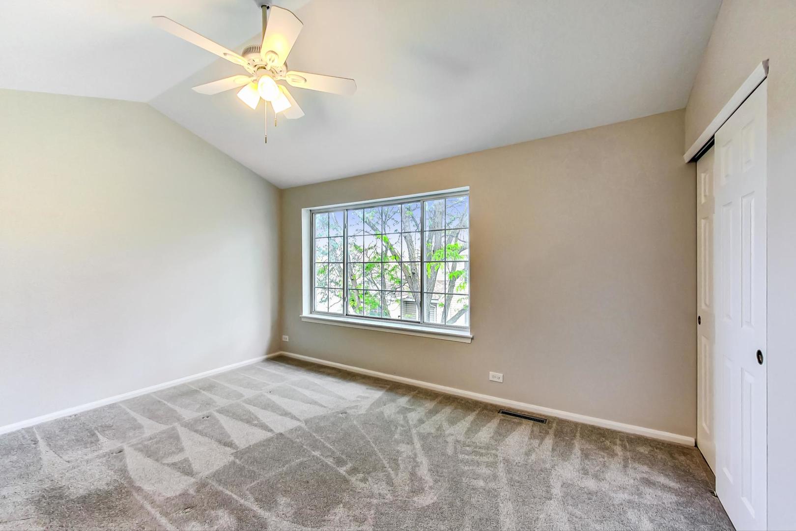 313 Rosebud Court, Unit 313 Bolingbrook, IL 60440 - Photo 23 of 31 a view of an empty room with a window