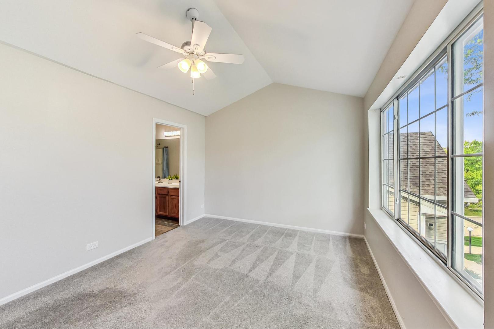 313 Rosebud Court, Unit 313 Bolingbrook, IL 60440 - Photo 24 of 31 a view of an empty room with a window