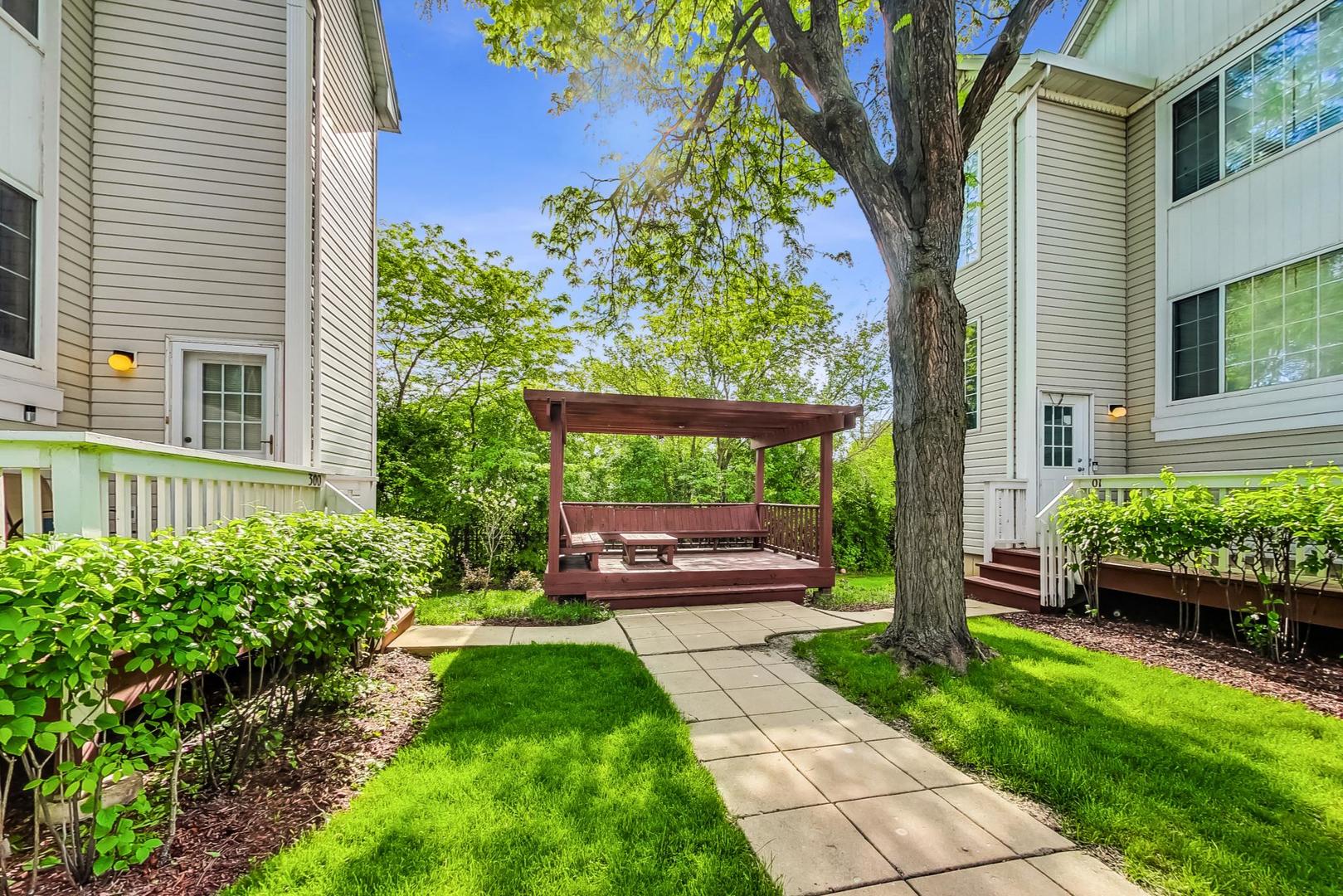 313 Rosebud Court, Unit 313 Bolingbrook, IL 60440 - Photo 27 of 31 a view of a house with a back yard