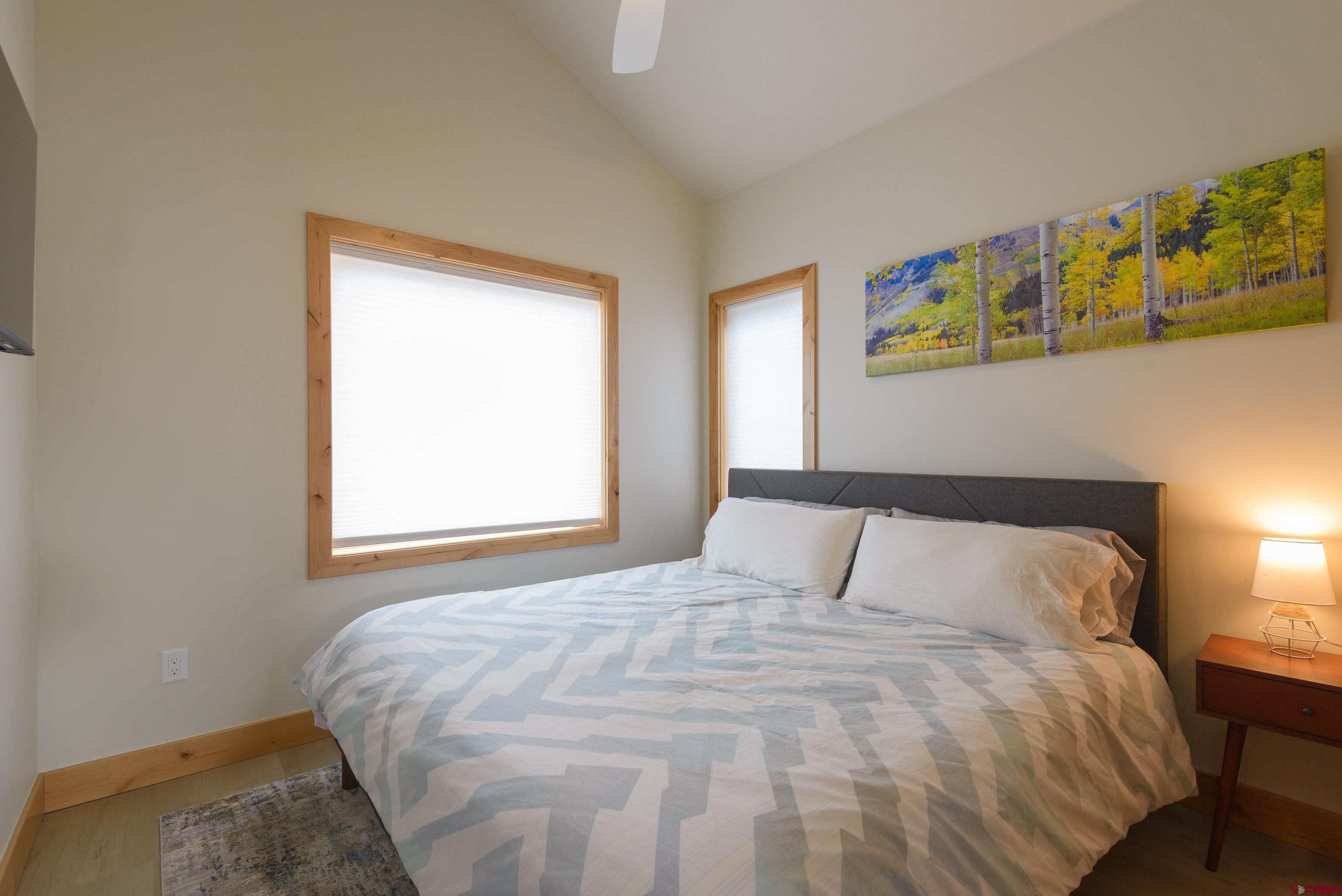 131 Elk Valley Road, Unit A Crested Butte, CO 81224 - Photo 12 of 29 a bedroom with a bed and window