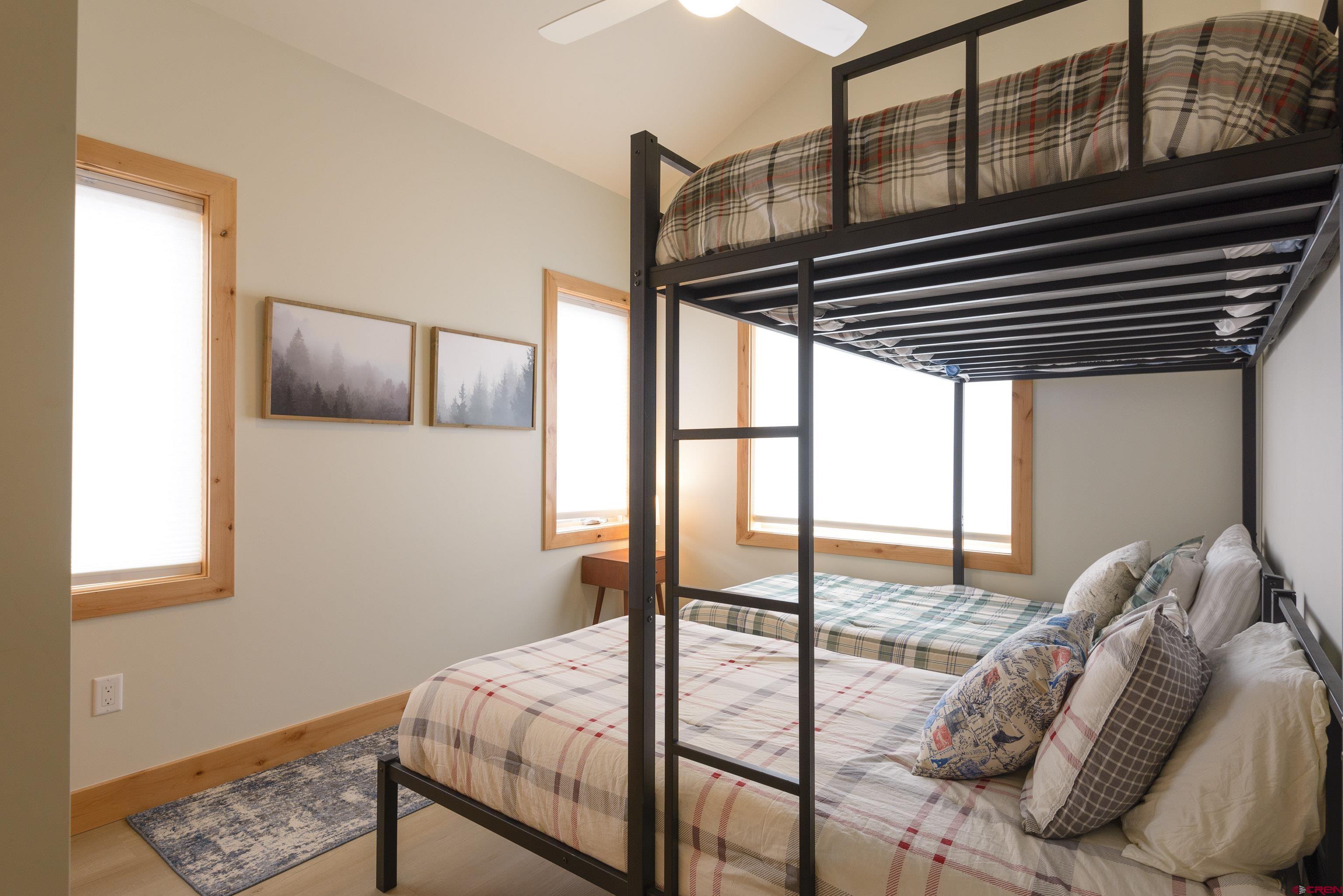 131 Elk Valley Road, Unit A Crested Butte, CO 81224 - Photo 14 of 29 a bedroom with a bed and a window